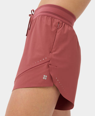 Sweaty Betty Runners High Loose Shorts | Sienna Pink